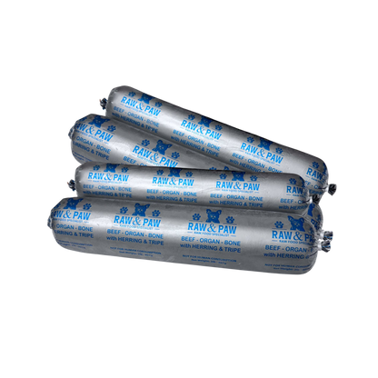A frozen chub of Raw & Paw Naturals' Beef with Herring raw dog food blend, showing its whole-food ingredients before thawing.